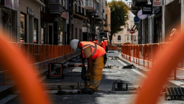 a construction worker is working on a street